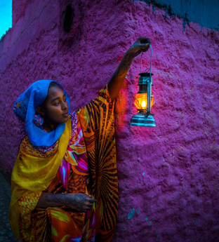 Local woman at dusk in Harar